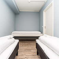 Ein weiteres Schlafzimmer mit 3 Einzelbetten in der Egnerbua.