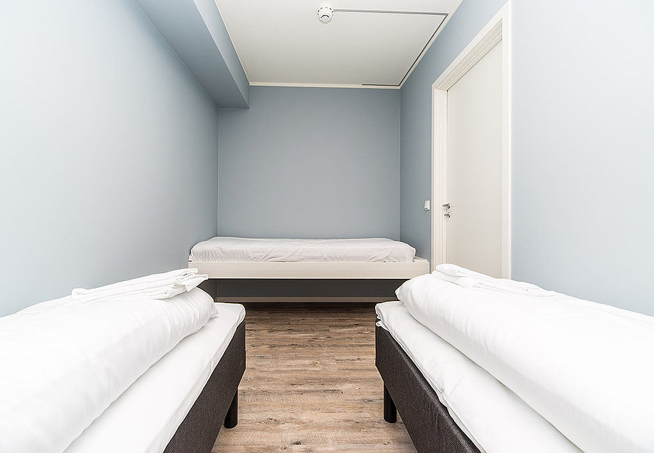 Ein weiteres Schlafzimmer mit 3 Einzelbetten in der Egnerbua.