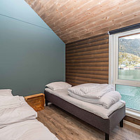 Schlafzimmer mit 2 Einzelbetten in der modernen Wohnung Lottebua.