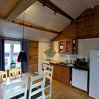 Wohnraum und Küche eines Apartments vom Typ 3+.